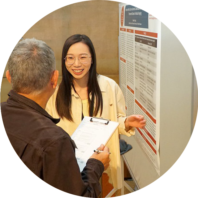 Student presenting at a poster session