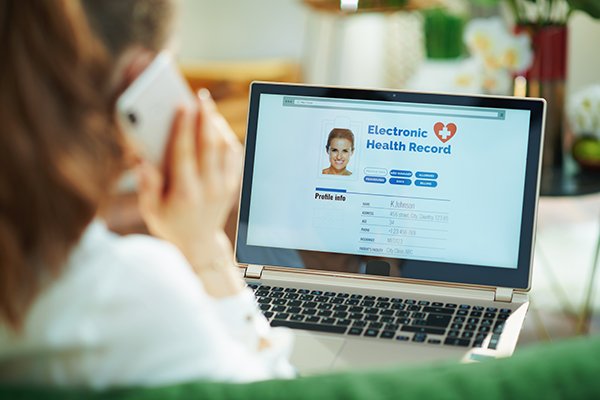 Photo of person looking at computer. (Photo by Getty Images)