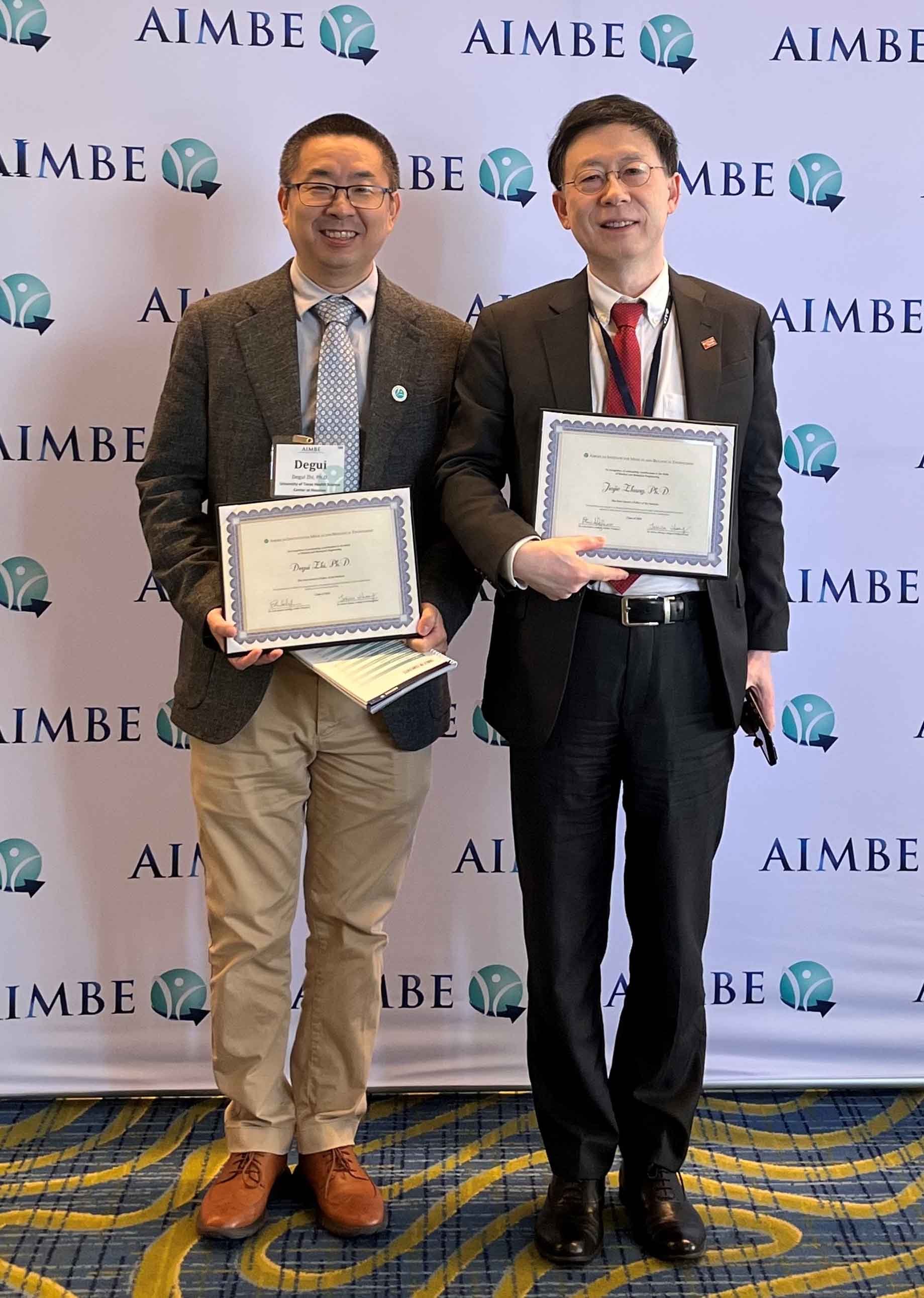 Degui Zhi, PhD, MS (left) and Jiajie Zhang, PhD at the 2025 AIMBE College of Fellows Induction Ceremony
