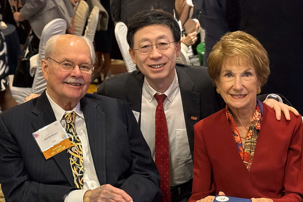 Jiajie Zhang, PhD, dean of McWilliams School of Biomedical Informatics at UTHealth Houston (center), with D. Bradley and Laura McWilliams at the Association of Fundraising Professionals Greater Houston Chapter luncheon. (Photo by UTHealth Houston)