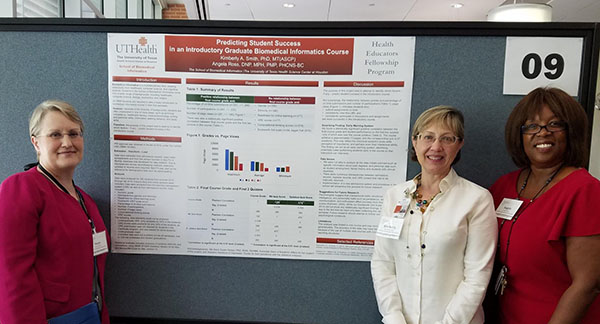 Kimberly Smith and Angela Ross standing in front of their research poster along with Susan Fenton
