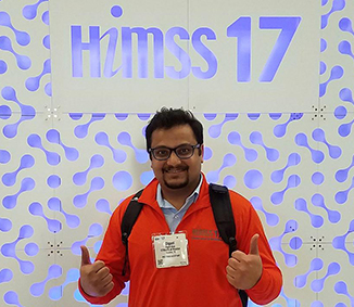Digant Shah, an SBMI student and HIMSS17 Program Assistant giving two thumbs up